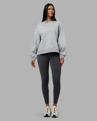 Woman wearing Full Form Fleece Sweater with Side Slits - Marl Grey | Model:Rhiley | Size:S