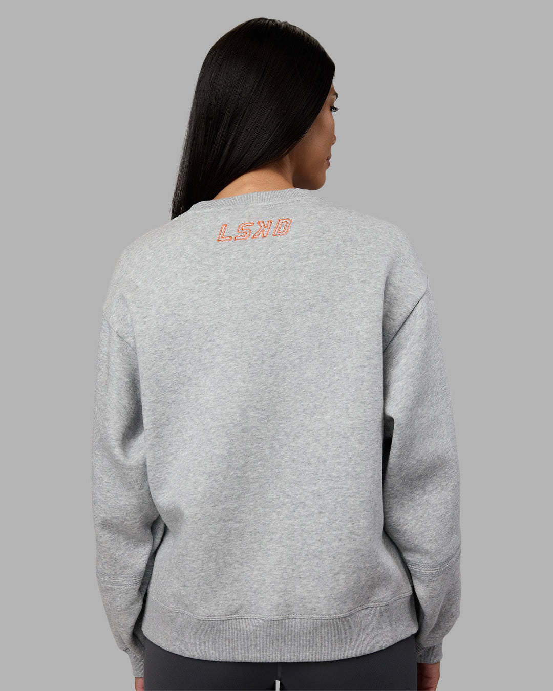 Woman wearing Full Form Fleece Sweater with Side Slits - Marl Grey | Model:Rhiley | Size:S