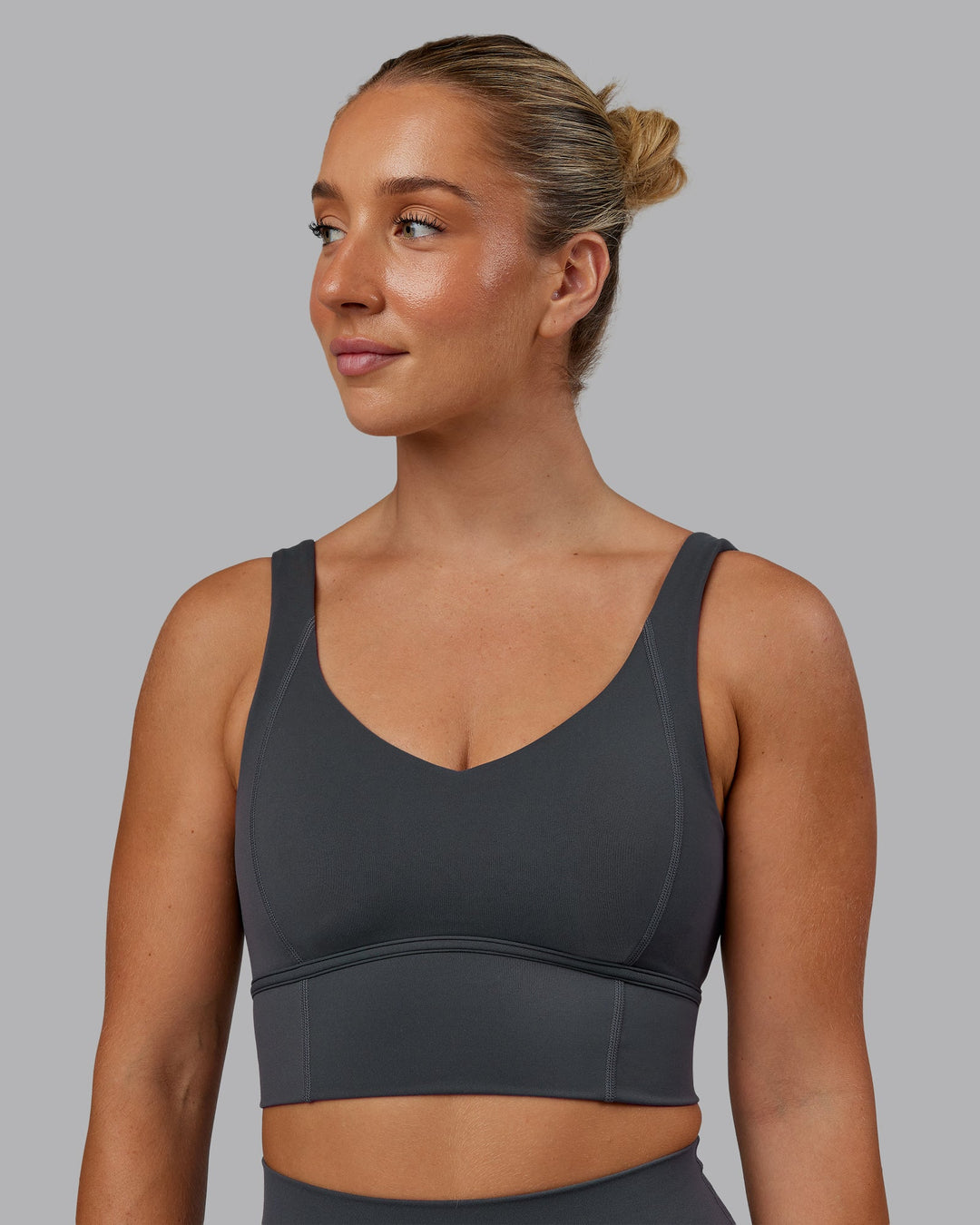 Woman wearing Function Longline Sports Bra in Dark Storm | Size:S