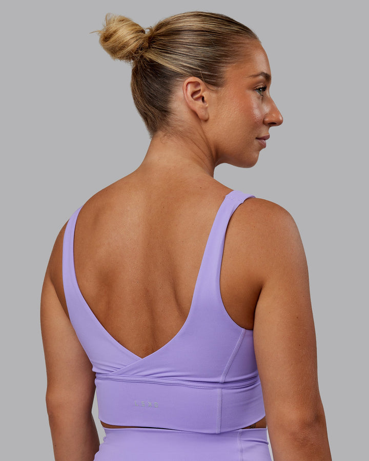 Woman wearing Function Longline Sports Bra in Violet Ray | Size:S
