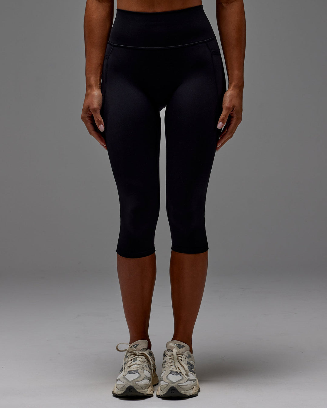 Woman wearing Fusion 3/4 Length Tight with Pockets in Black | Size:S