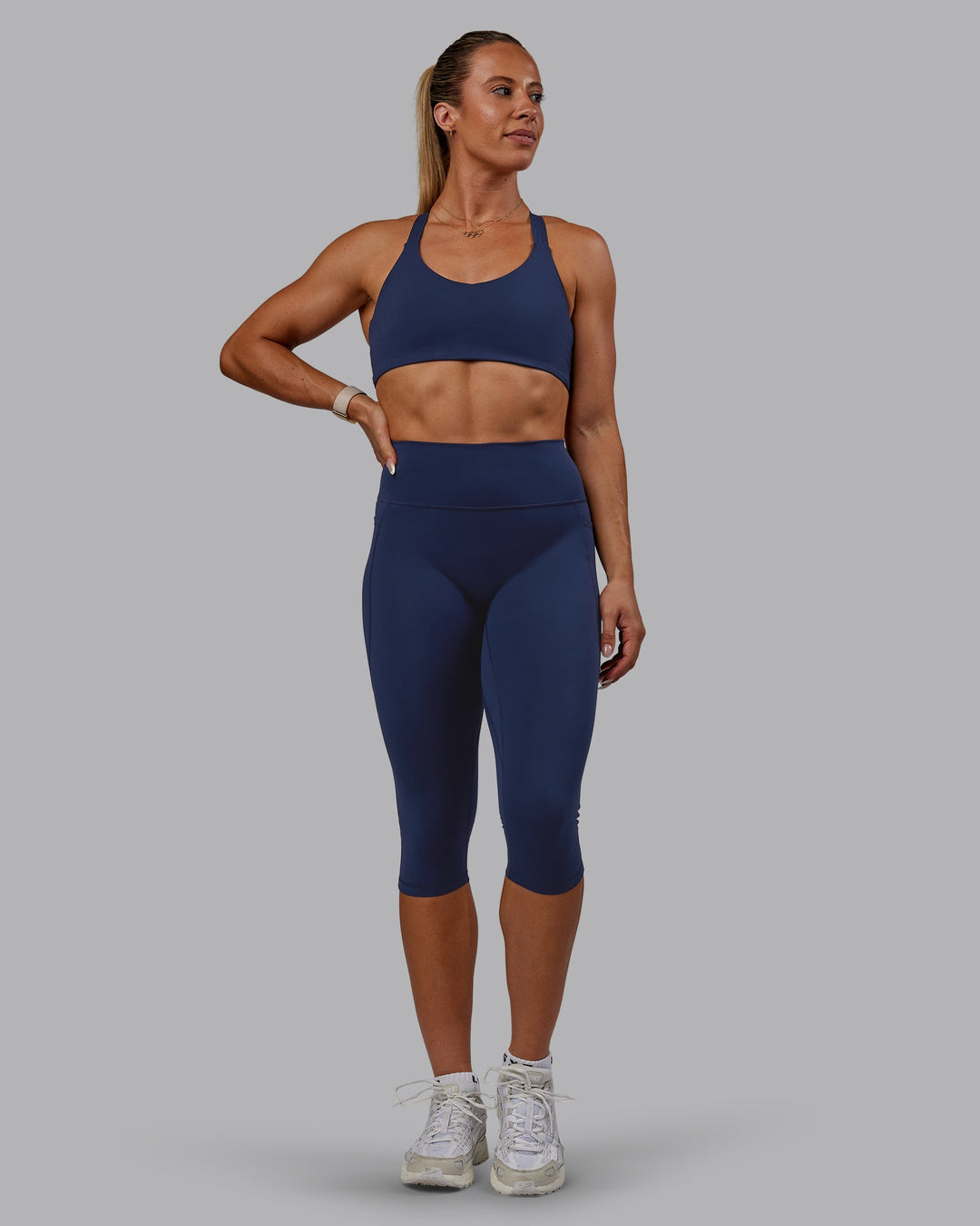Woman wearing Fusion Ultra High-Rise 3/4 Legging Pockets - Future Navy | Model:Bree | Size:S