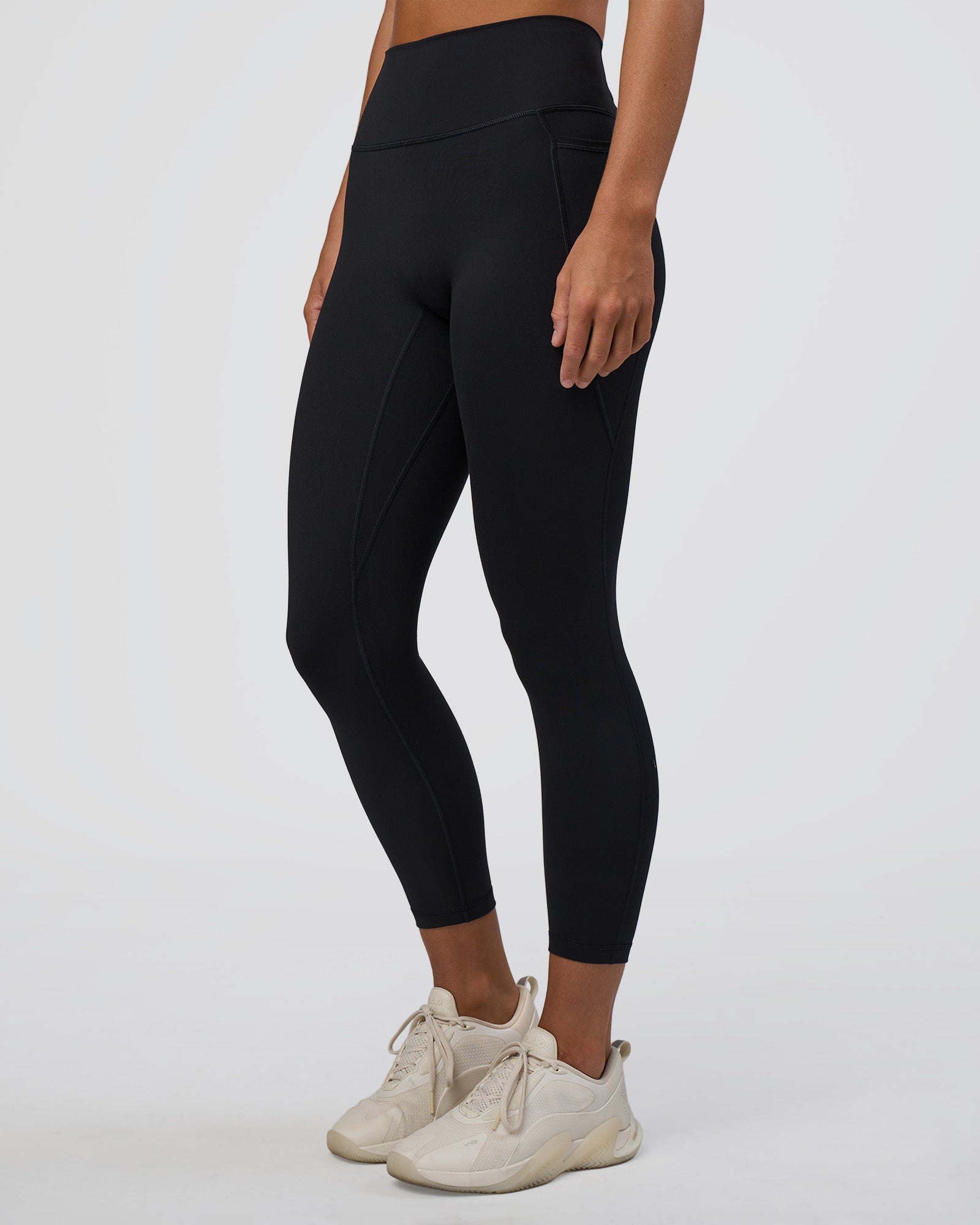 Woman wearing Fusion Ultra High-Rise 7/8 Legging Pockets - Black | Model:Amity | Size:S