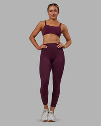 Woman wearing Fusion Ultra High-Rise 7/8 Legging Pockets - Cherry Lacquer | Model:Paris | Size:S | Thumbnail Index: 1