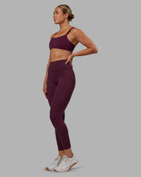Woman wearing Fusion Ultra High-Rise 7/8 Legging Pockets - Cherry Lacquer | Model:Paris | Size:S | Thumbnail Index: 6