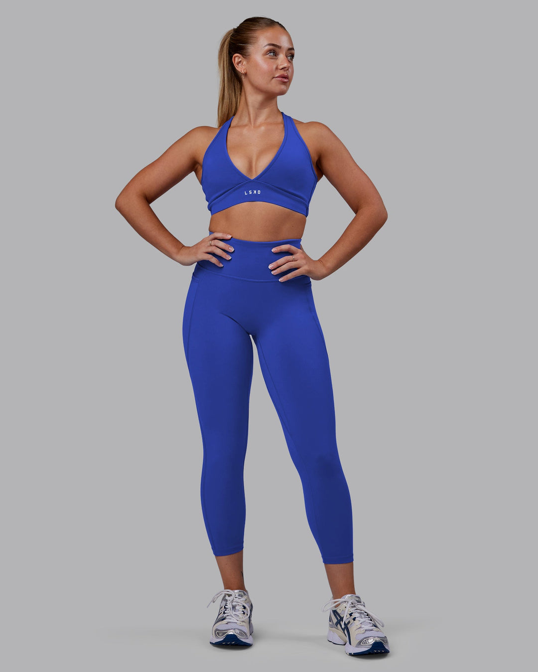 Woman wearing Fusion Ultra High-Rise 7/8 Legging Pockets - Power Cobalt | Model:Hannah | Size:S