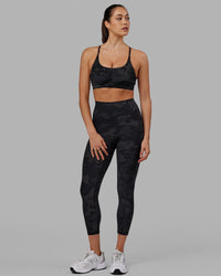 Woman wearing Fusion Ultra High-Rise 7/8 Legging Pockets - Black-Camo | Model:Katie | Size:S | Thumbnail Index: 0
