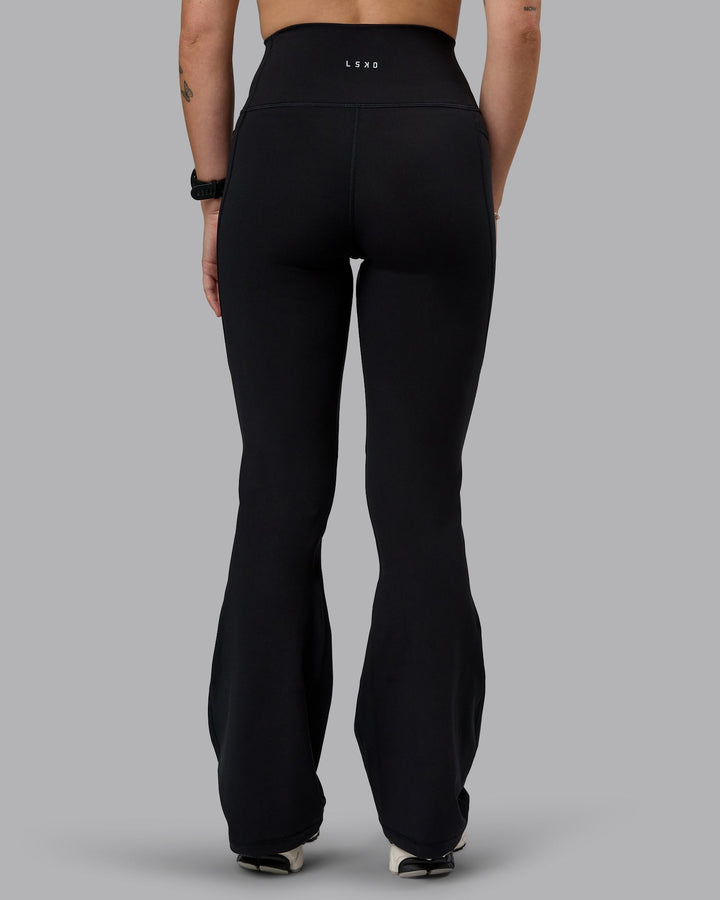 Woman wearing Fusion Everyday Flared Petite Tight With Pockets - Black| Model:Bianca | Size:S
