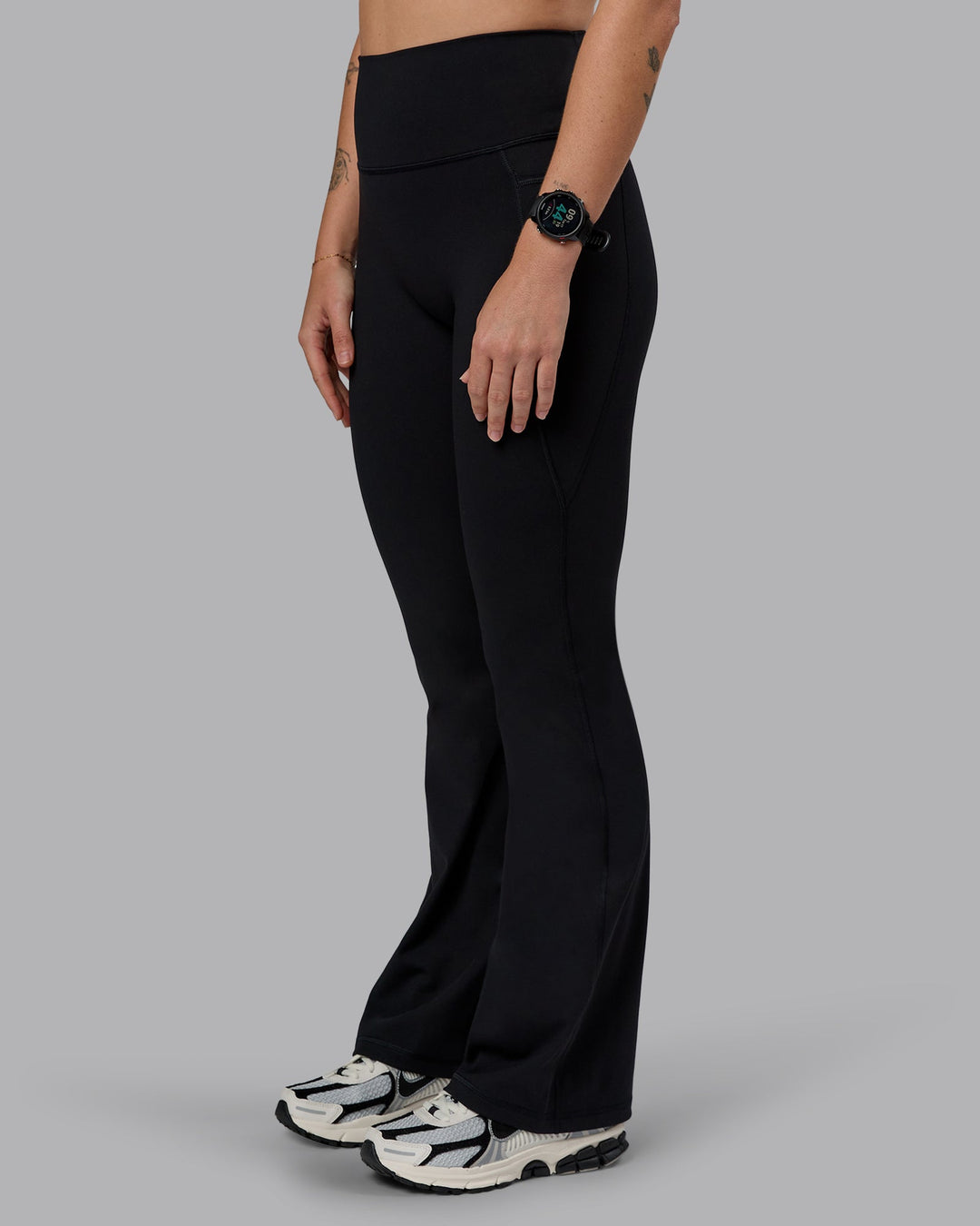 Woman wearing Fusion Everyday Flared Petite Tight With Pockets - Black| Model:Bianca | Size:S