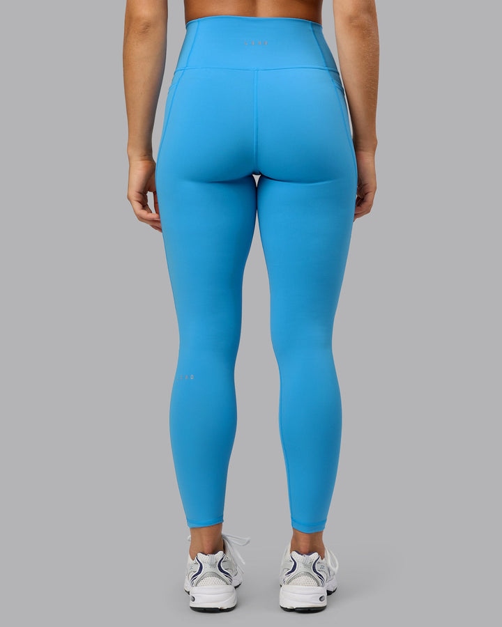 Woman wearing Fusion Full Length Tights with Pockets in Azure Blue | Size:S
