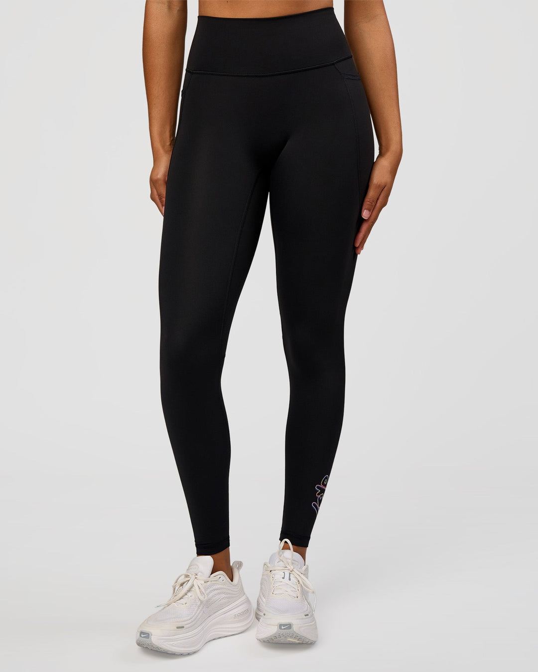 Woman wearing Fusion Graphic Ultra High-Rise Full Length Legging Pockets - Black-Radiate | Model:Rosie | Size:S