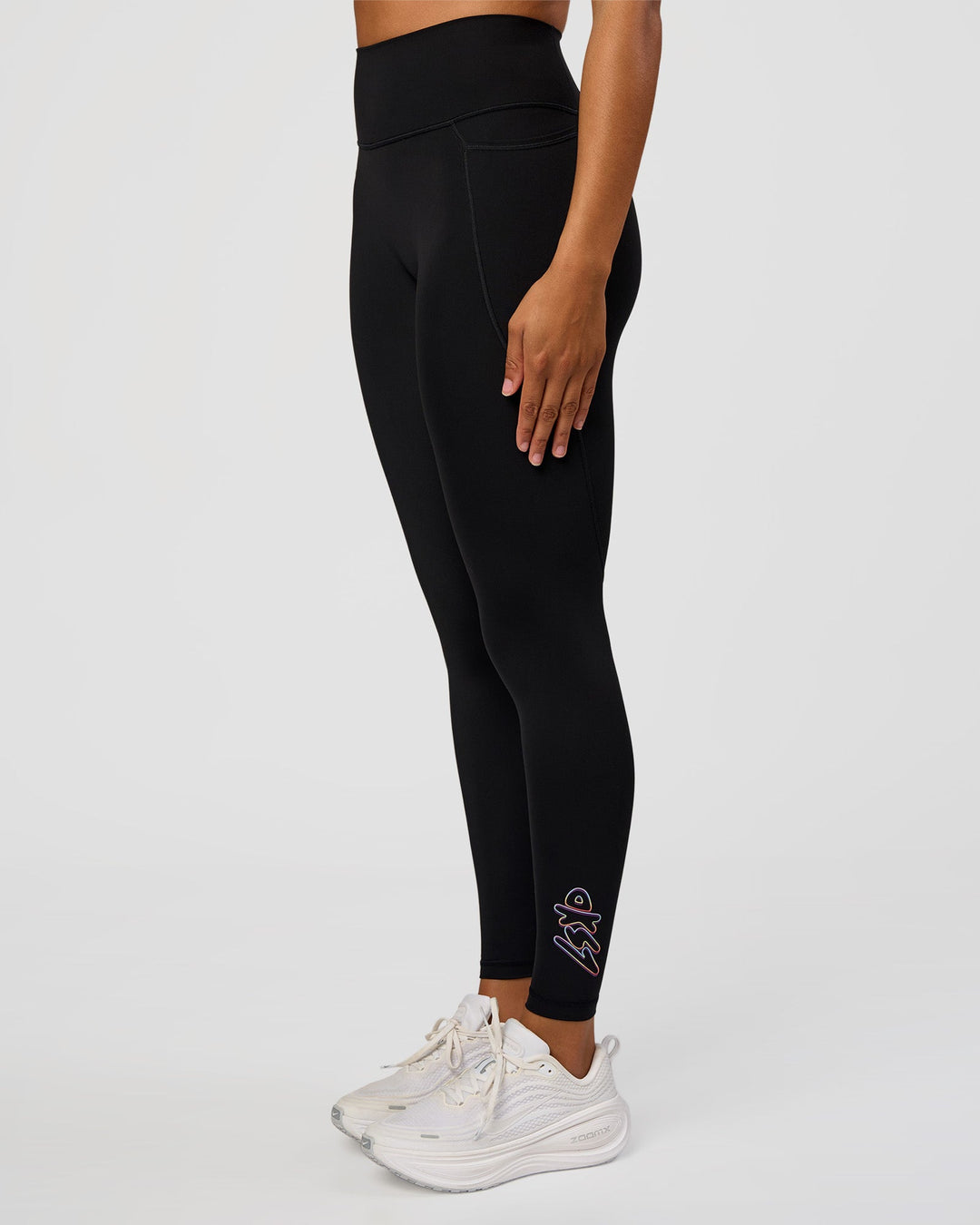 Woman wearing Fusion Graphic Ultra High-Rise Full Length Legging Pockets - Black-Radiate | Model:Rosie | Size:S
