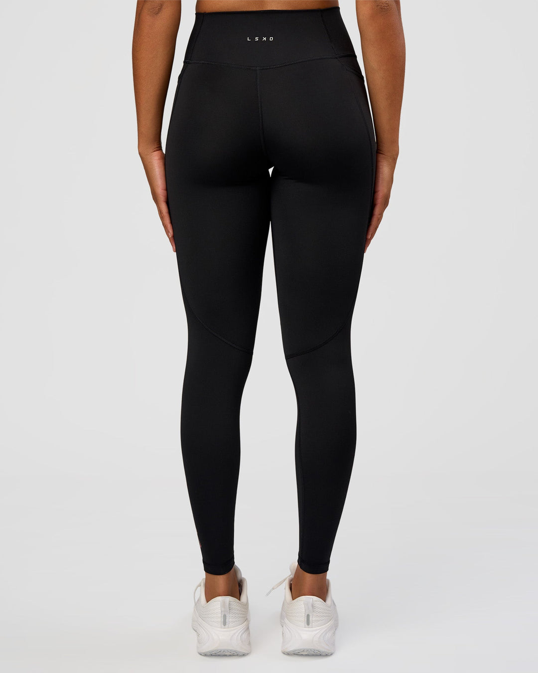 Woman wearing Fusion Graphic Ultra High-Rise Full Length Legging Pockets - Black-Radiate | Model:Rosie | Size:S