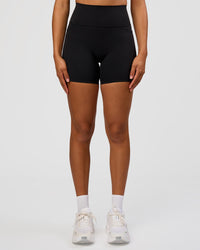 Woman wearing Fusion Graphic Ultra High-Rise 6" Short Pockets - Black-Radiate | Model:Rosie | Size:S