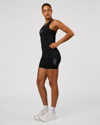 Woman wearing Fusion Graphic Ultra High-Rise 6" Short Pockets - Black-Radiate | Model:Rosie | Size:S