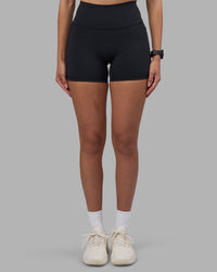 Woman wearing Fusion High-Rise 4" Short Pockets - Black | Model:Rhiley | Size:S