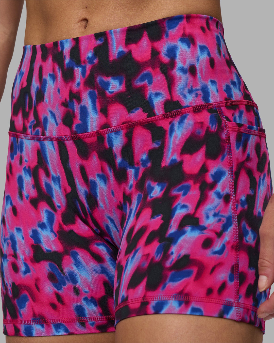 Woman wearing Fusion High-Rise 4" Short Pockets - Pink Luminous | Model:Hannah | Size:S