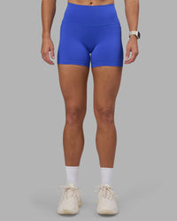 Woman wearing Fusion High-Rise 4" Short Pockets - Power Cobalt | Model:Hannah | Size:S