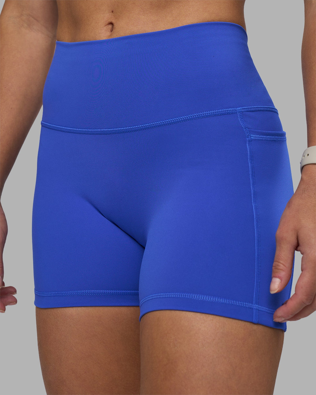 Woman wearing Fusion High-Rise 4&quot; Short Pockets - Power Cobalt | Model:Hannah | Size:S