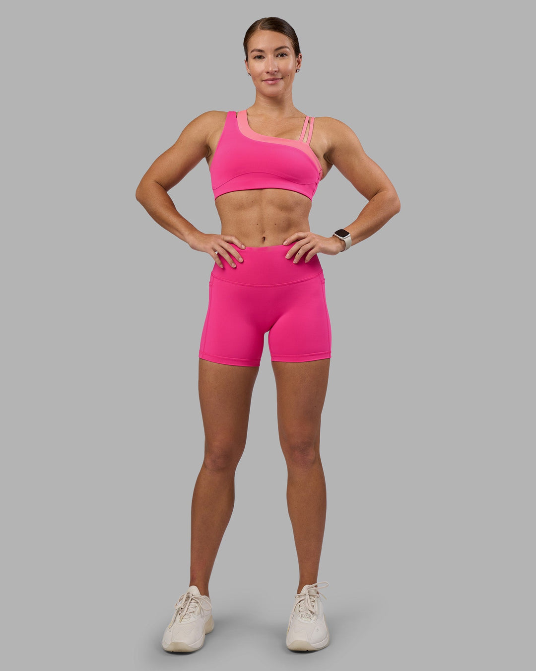 Woman wearing Fusion High-Rise 4&quot; Short Pockets - Ultra Pink | Model:Hannah | Size:S