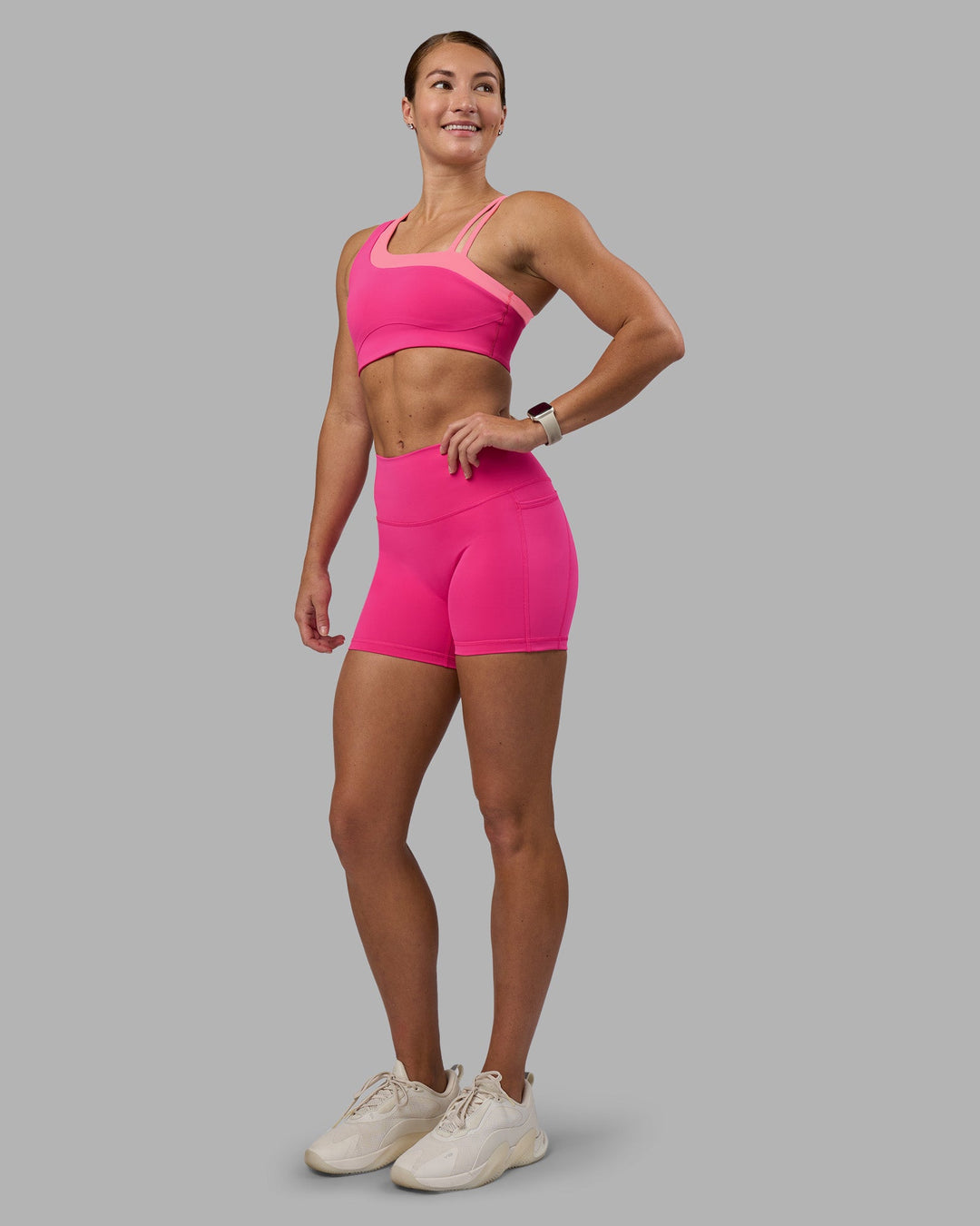Woman wearing Fusion High-Rise 4&quot; Short Pockets - Ultra Pink | Model:Hannah | Size:S