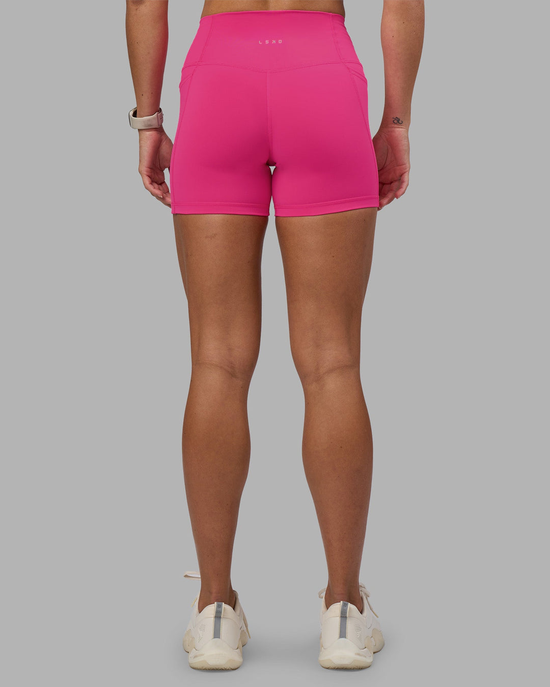 Woman wearing Fusion High-Rise 4&quot; Short Pockets - Ultra Pink | Model:Hannah | Size:S