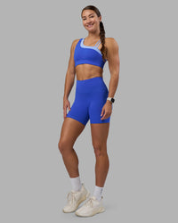 Woman wearing Fusion High-Rise 6" Short Pockets - Power Cobalt | Model:Hannah | Size:S