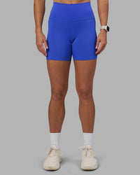 Woman wearing Fusion High-Rise 6" Short Pockets - Power Cobalt | Model:Hannah | Size:S