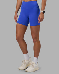 Woman wearing Fusion High-Rise 6" Short Pockets - Power Cobalt | Model:Hannah | Size:S