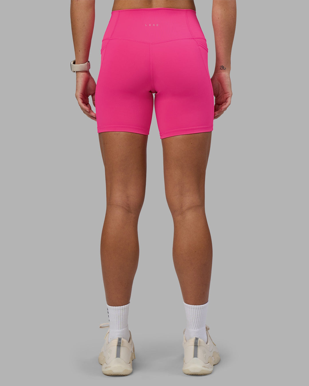 Woman wearing Fusion High-Rise 6&quot; Short Pockets - Ultra Pink | Model:Hannah | Size:S