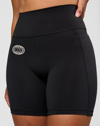 Woman wearing Fusion Hype Graphic Ultra High-Rise 6" Short Pockets - Black-Alloy | Model:Rhiley | Size:S