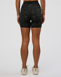 Woman wearing Fusion Icon Ultra High-Rise 6" Short Pockets - Energy Print Black | Model:Amity | Size:S