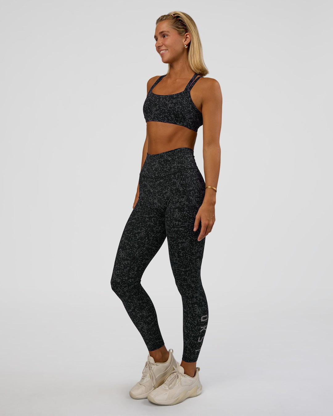 Woman wearing Fusion Icon Ultra High-Rise Full Length Legging Pockets - Energy Print Black-Reflective | Model:Amity | Size:S