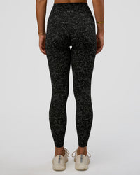 Woman wearing Fusion Icon Ultra High-Rise Full Length Legging Pockets - Energy Print Black-Reflective | Model:Amity | Size:S