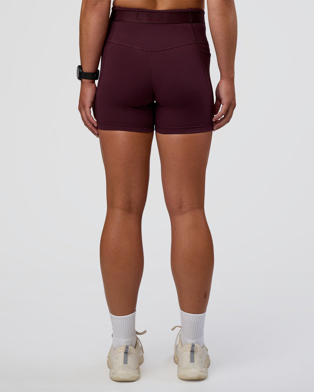 Woman wearing Fusion Jacquard High-Rise 4” Short Pockets - Cherry Lacquer | Model:Sav | Size:S