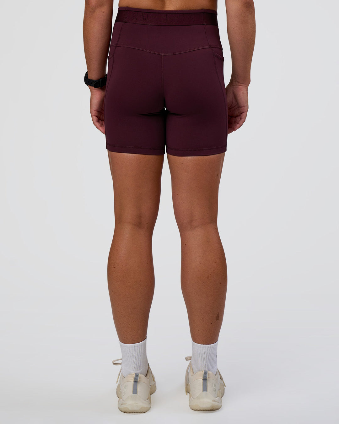Woman wearing Fusion Jacquard High-Rise 6&quot; Short Pockets - Cherry Lacquer | Model:Sav | Size:S