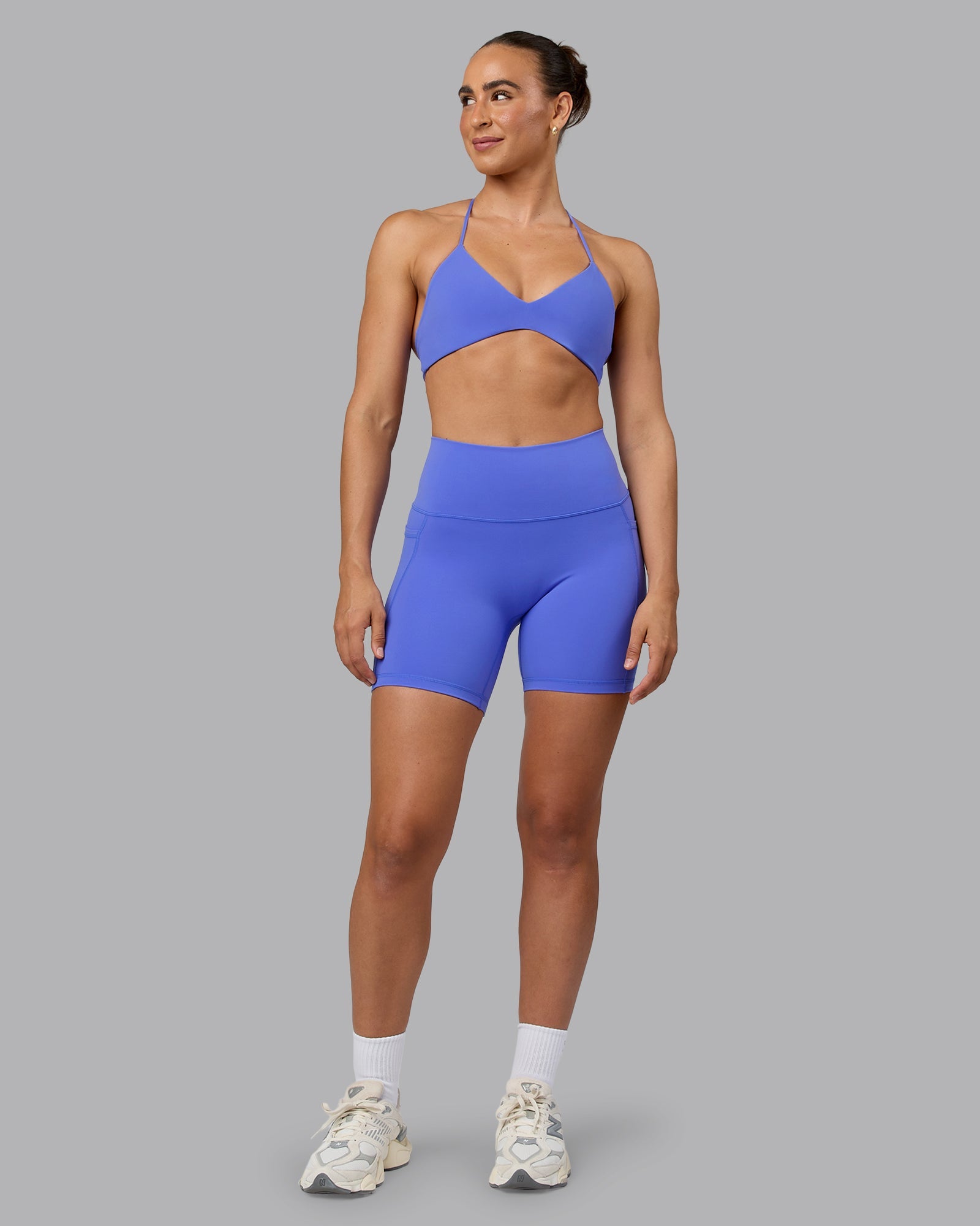 Woman wearing Fusion Ultra High-Rise 6" Short Pockets - Baja Blue | Model:Sophie | Size:S