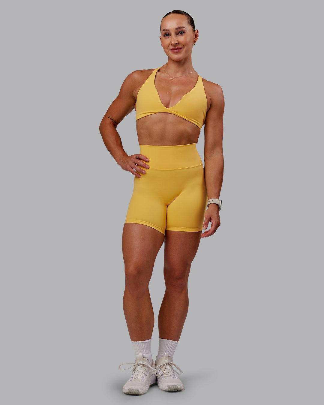 Woman wearing Fusion Mid Short Tight in Banana Cream | Size:S