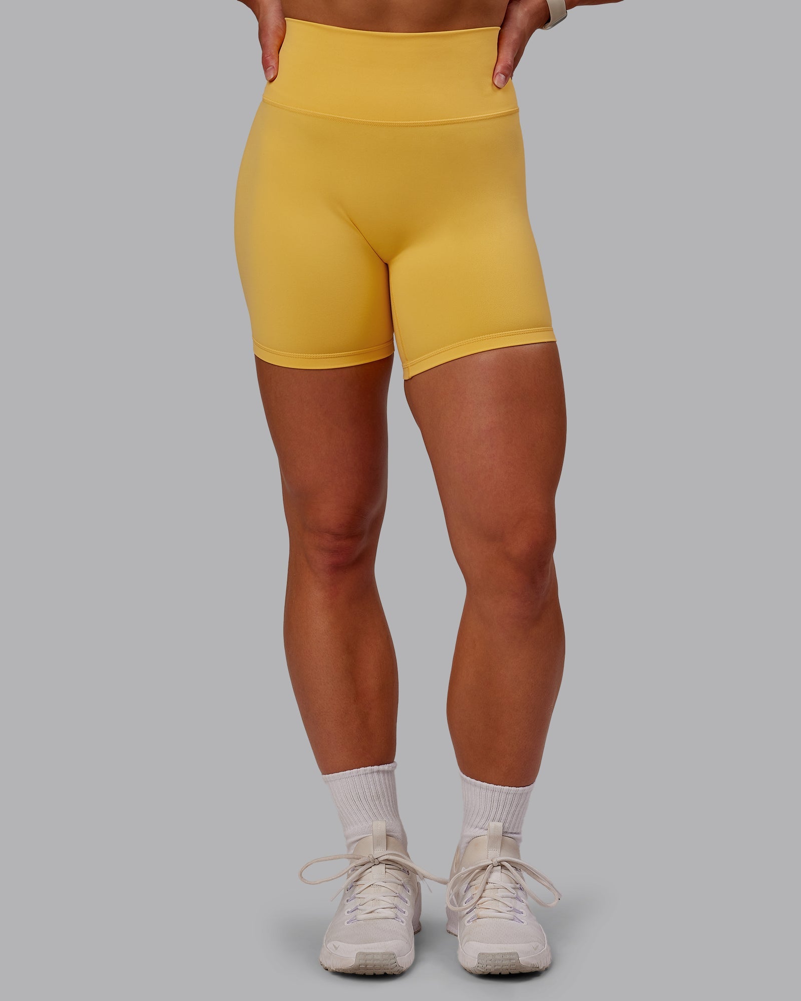Woman wearing Fusion Ultra High-Rise 6" Short - Banana Cream | Model:Amber | Size:S