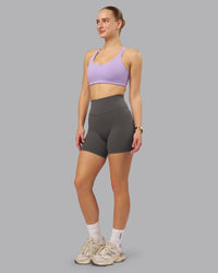 Woman wearing Fusion Ultra High-Rise 6" Short - Dark Storm | Model:Lillie | Size:S