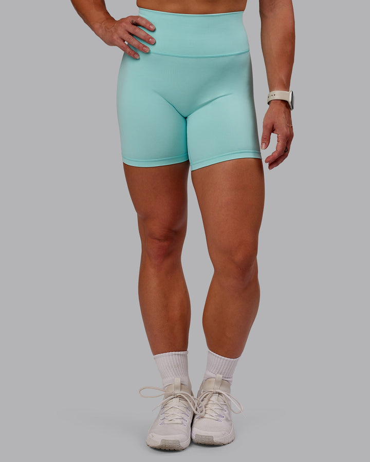 Woman wearing Fusion Mid Short Tight in Island Paradise | Size:S
