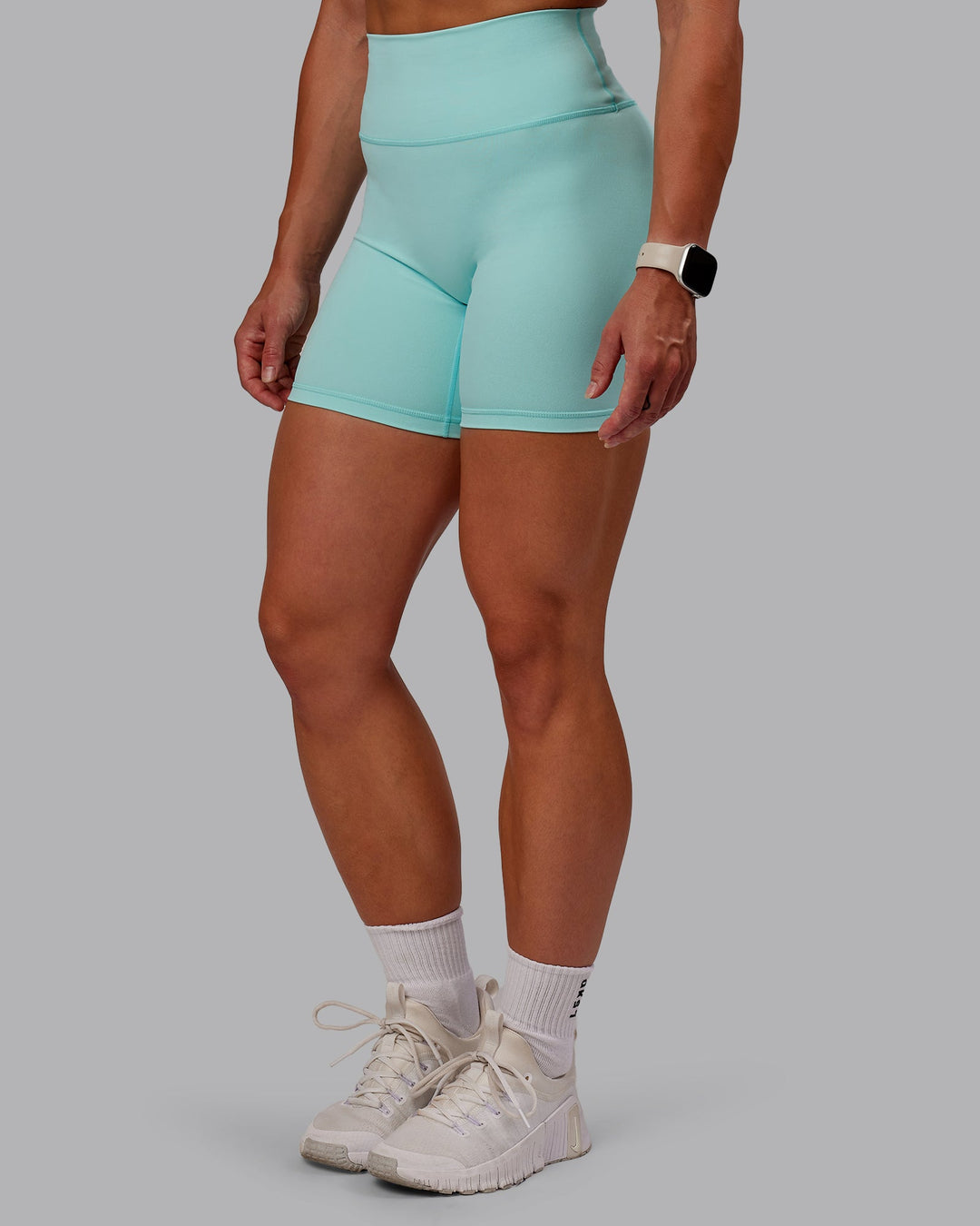 Woman wearing Fusion Mid Short Tight in Island Paradise | Size:S