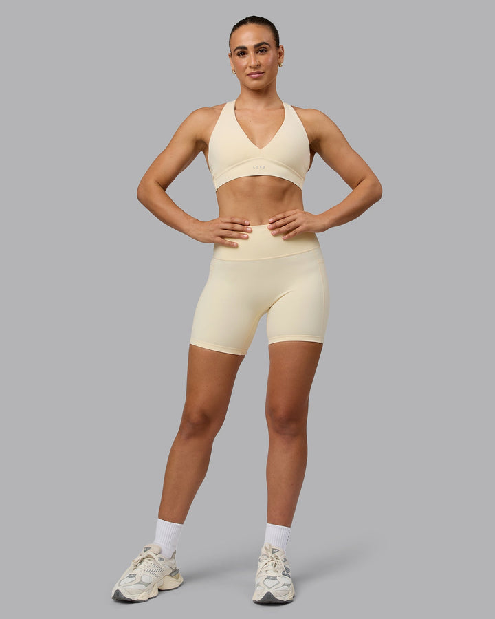 Woman wearing Fusion Mid Short Tights with Pockets - Ivory
