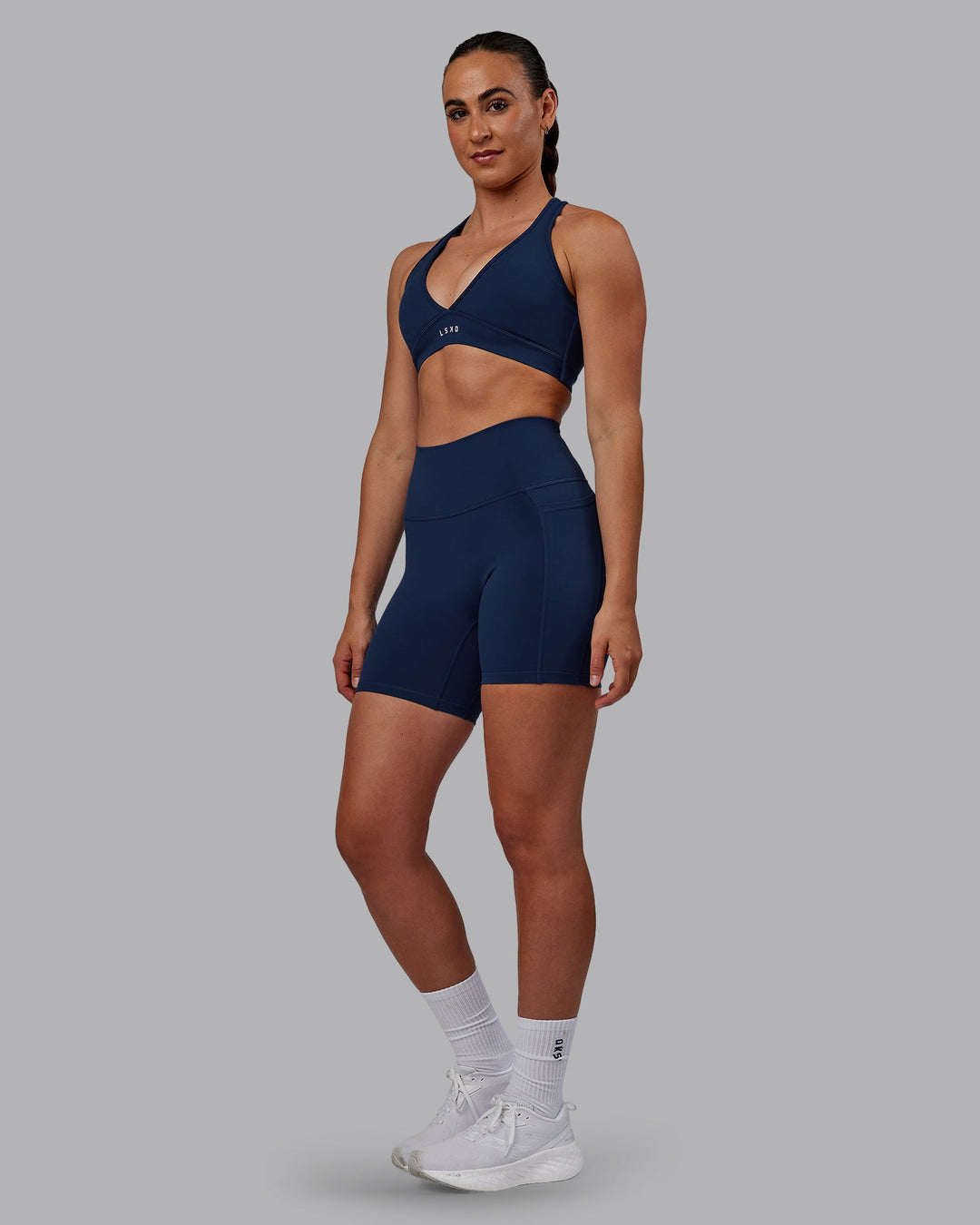 Woman wearing Fusion Mid Short Tights with Pockets - Future Navy