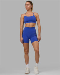Woman wearing Fusion Ultra High-Rise 6" Short Pockets - Power Cobalt | Model:Hannah | Size:S