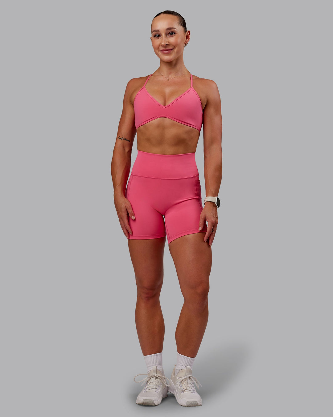 Woman wearing Fusion Mid Short Tight With Pockets - Hot Pink