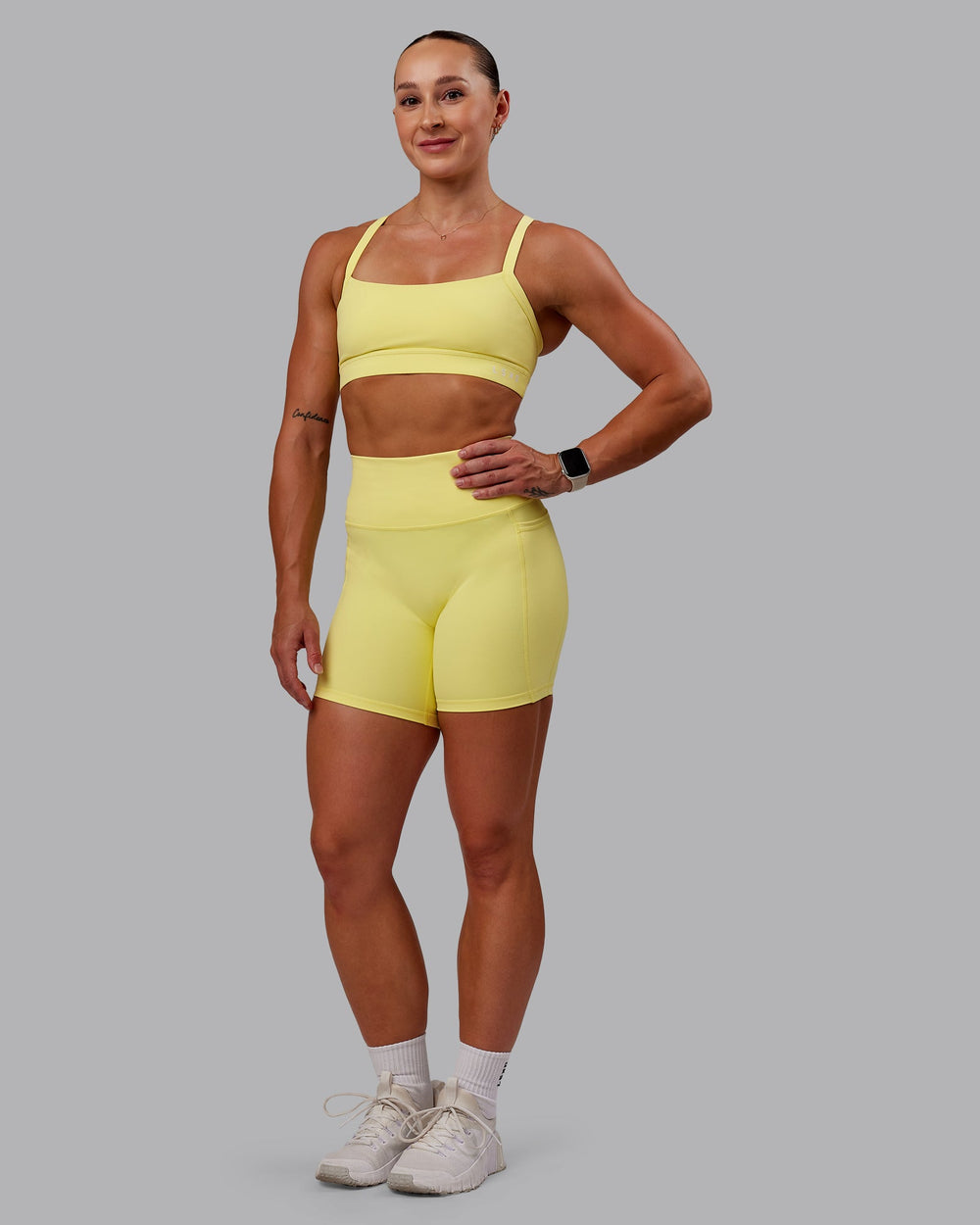 Woman wearing Fusion Mid Short Tight With Pockets - Lemon Fizz