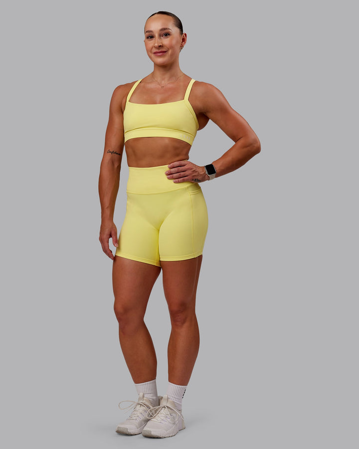 Woman wearing Fusion Mid Short Tight With Pockets - Lemon Fizz
