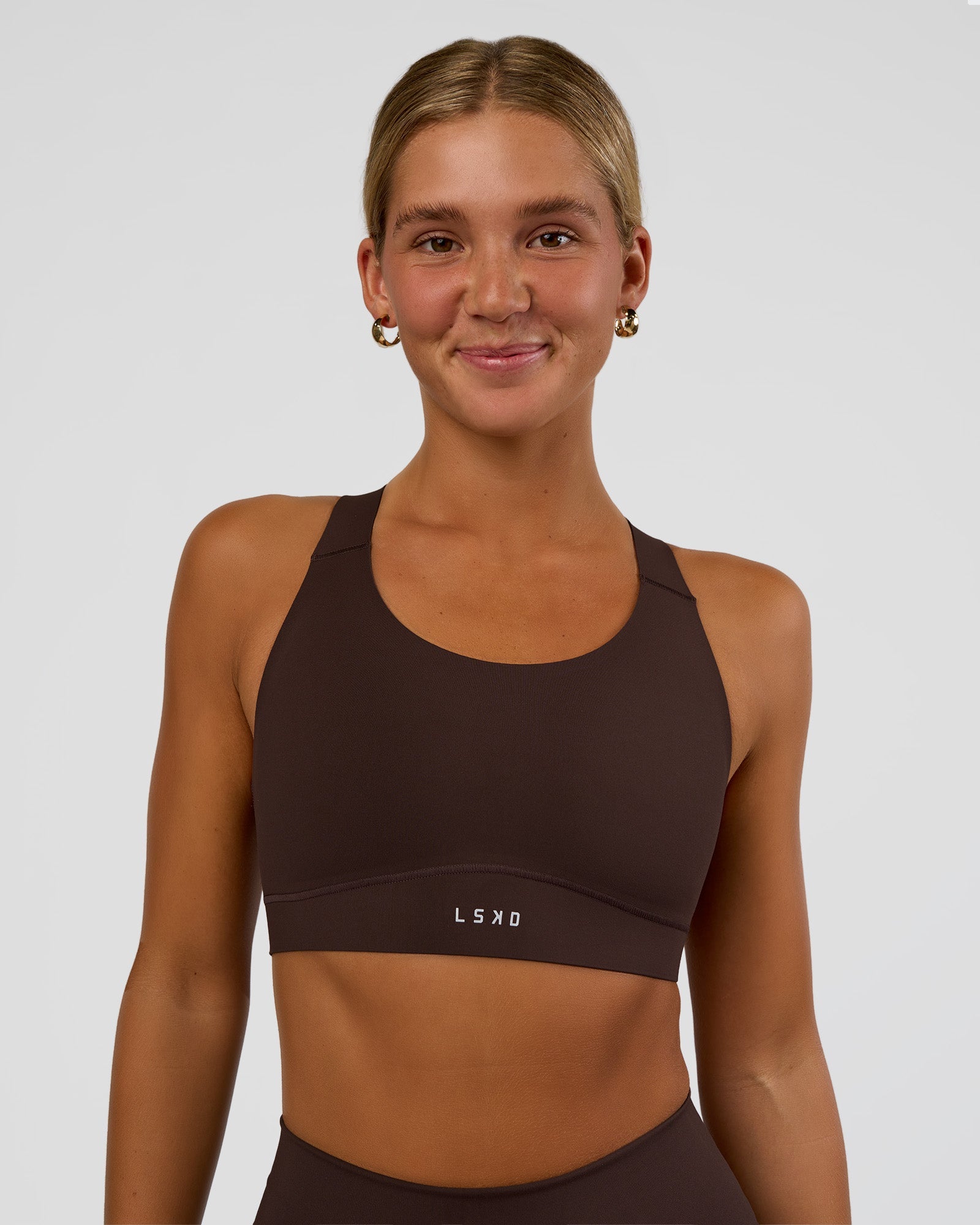 Woman wearing Fusion Sports Bra 2.0 - Hot Chocolate | Model:Amity | Size:S