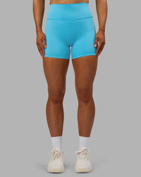 Woman wearing Fusion Ultra High-Rise 4" Short - Blue Atoll | Set:true | Angle:front | Model:Georgia | Size:S